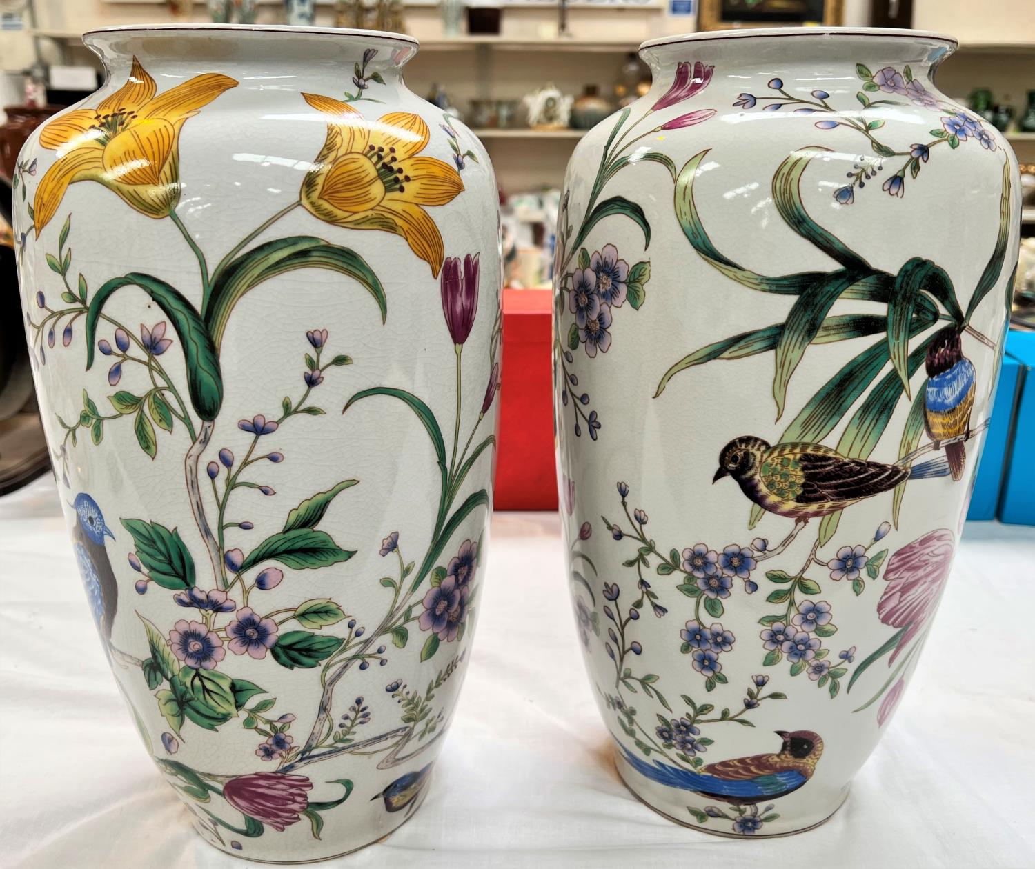 A modern Chinese pair of crackle glaze vases decorated with flowers and birds, height 36cm