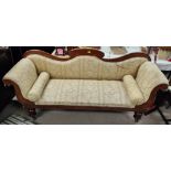 A Victorian mahogany settee with serpentine back and scroll arms in fawn patterned fabric on