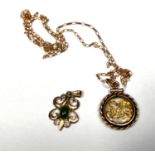 A rope twist circular pendant set yellow metal shavings, stamped '12KT' on 9 carat hallmarked gold