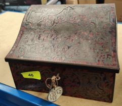 A red boulle correspondence box with slope top and fitted interior
