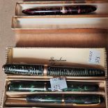 A vintage Parker 14k nib Duofold;  A Burnham fountain pen and pencil and a fountain pen