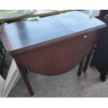 A mahogany dining table with oval drop leaf top; a mahogany inlaid and canted side table