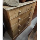A Victorian stripped pine chest of 3 long and 2 sort drawers