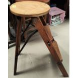A vintage stripped wood folding 'Atlas' stool with two steps and a circular top.
