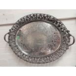 A 19th century silver plated large oval tray with pierced vine border and chased decoration,