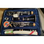 A Selmer Pride clarinet in fitted box with music and folding music stand