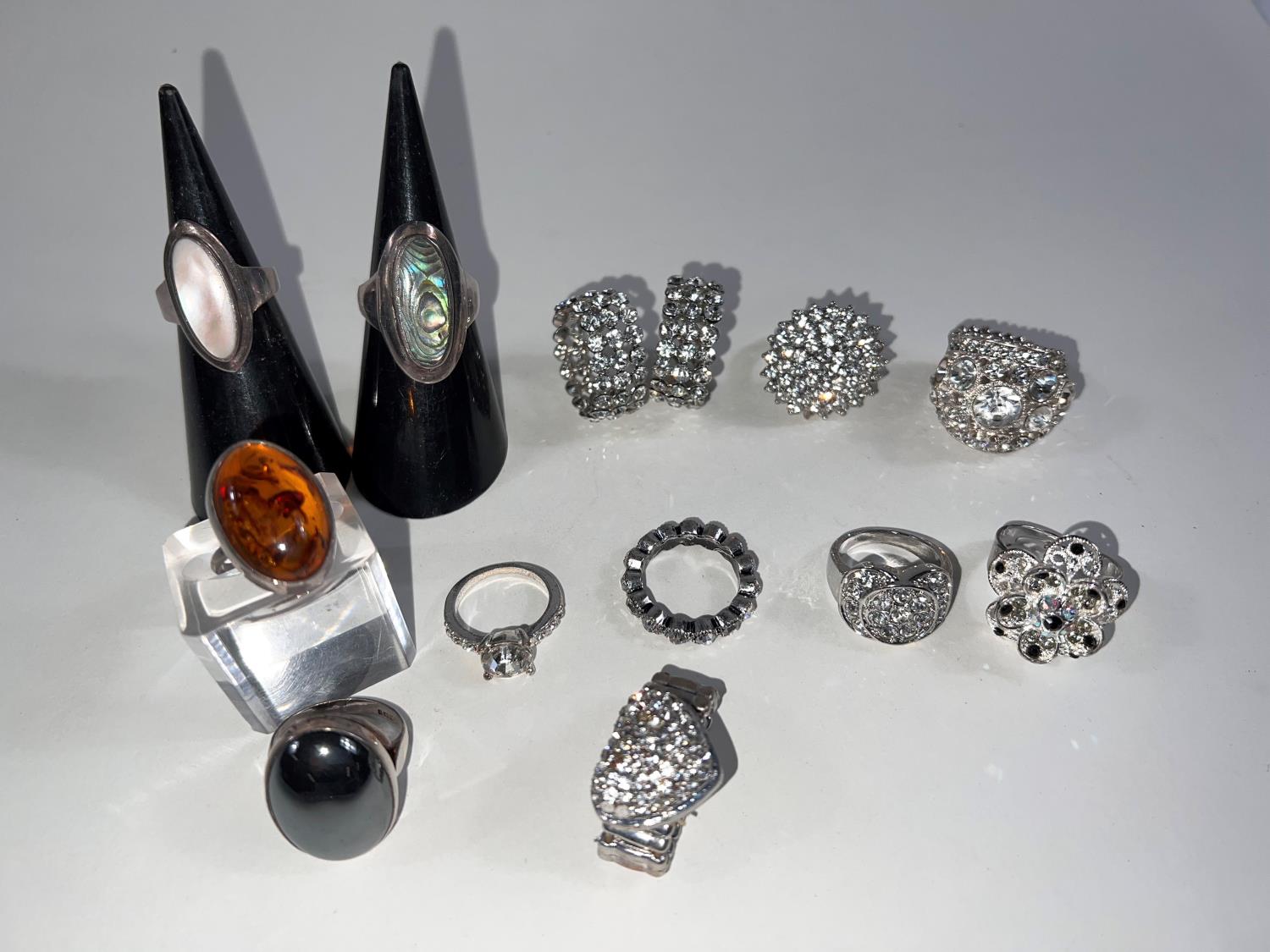 A selection of 14 fancy dress rings, 2 of which are hallmarked silver, others diamante etc