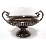 An early 20th century silver campana shaped 2 handled pedestal rose bowl with gadrooned
