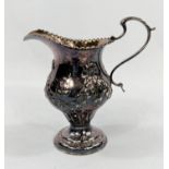 A Georgian hallmarked silver baluster cream jug on pedestal base with embossed swags, London 1773,