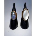A 9 carat hallmarked gold lady's dress ring on broad shank with inset oval mother of pearl; a