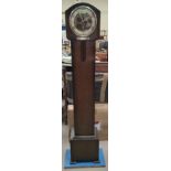 A 1930's chiming granddaughter clock in oak case