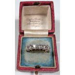 An 18 carat hallmarked gold half eternity ring set 7 diamonds, 3.5mm diameter of stones approx