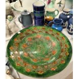 A large Stoneware plaque with green lustre ground in the Portuguese manner with other Studio pottery