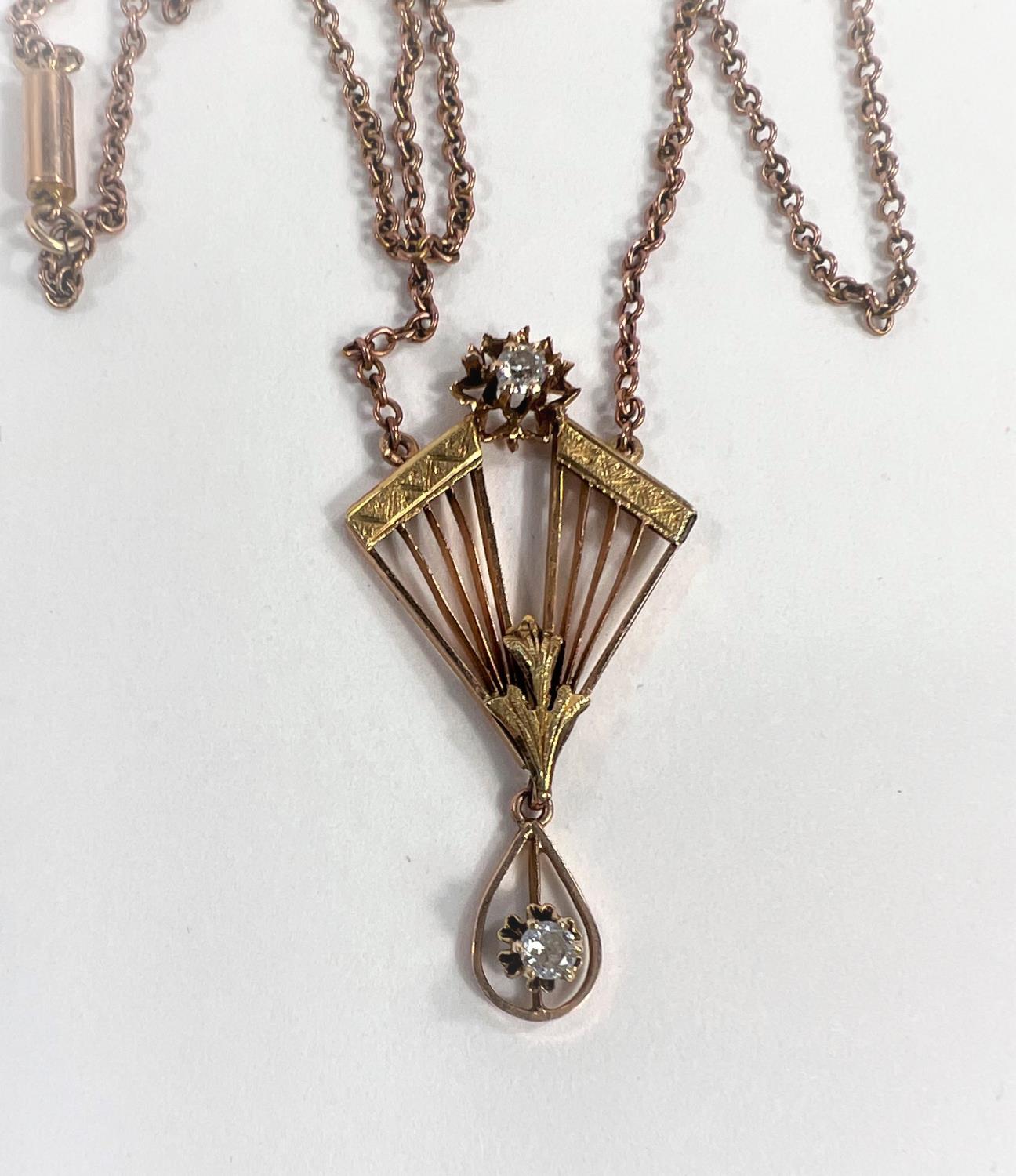 An Art Deco fan shaped yellow metal pendant set with diamond to top loop and the drop below, with - Image 2 of 2