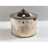A late 18th century plain oval silver tea caddy, domed top with pineapple finial, beaded borders,