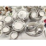 68 piece Royal Doulton burgundy dinner service with lidded tureens, gravy boats etc.