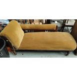 An Edwardian walnut chaise longue with incised decoration, turned legs and gold dralon upholstery