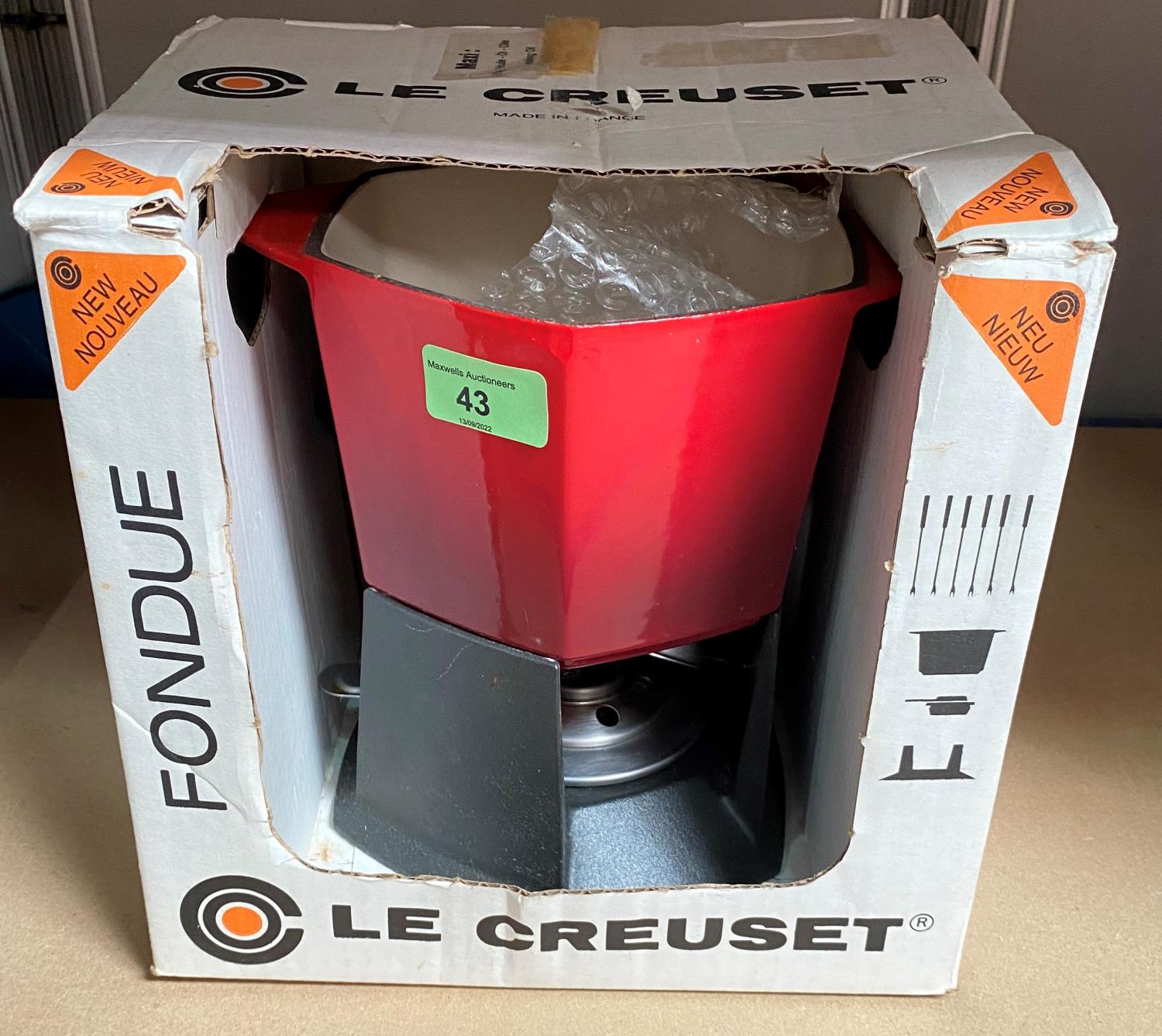 A boxed Le Creuset fondue set