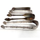 Four pairs of silver sugar tongs, one London 1785 by Thomas Wallis, others various dates/assay