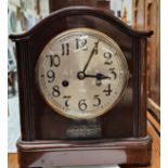 A chiming mantel clock in mahogany case, height 29cm