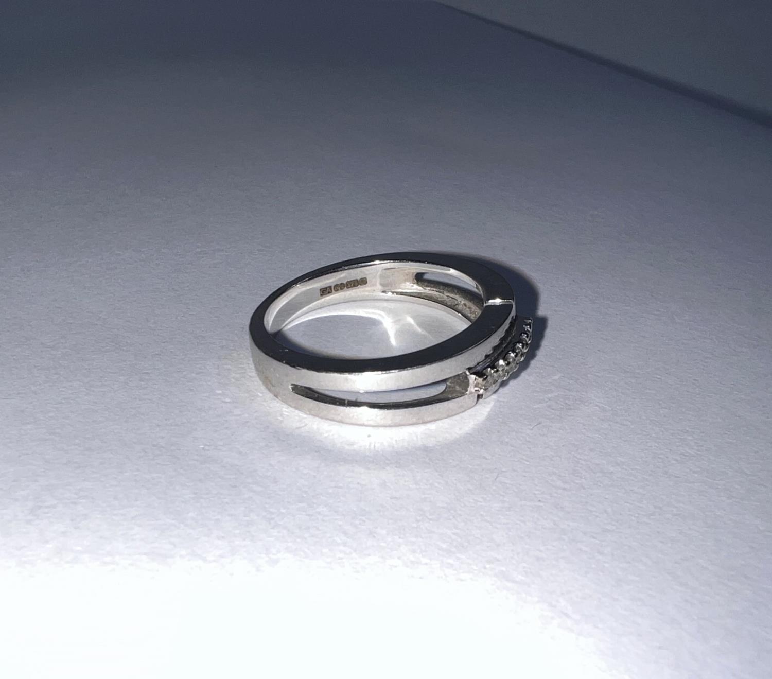 A 9 carat hallmarked white gold dress ring with 7 small diamonds in split shank setting, 4.2 gm - Image 2 of 3