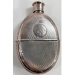 A silver hip flask and stirrup cup with engine turned decoration and circular crest 'Suum Cuique'