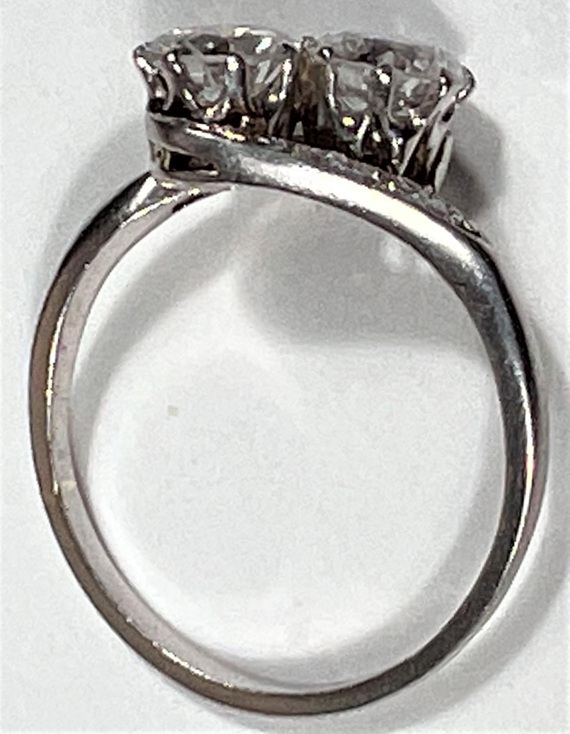 A white metal ring stamped 'Pt', with 2 diamonds in crossover setting, each shoulder set 4 small - Image 5 of 7