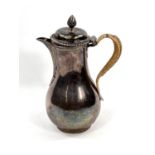 A Georgian hallmarked silver baluster coffee pot with pineapple finial, gadrooned rim, reeded spout,