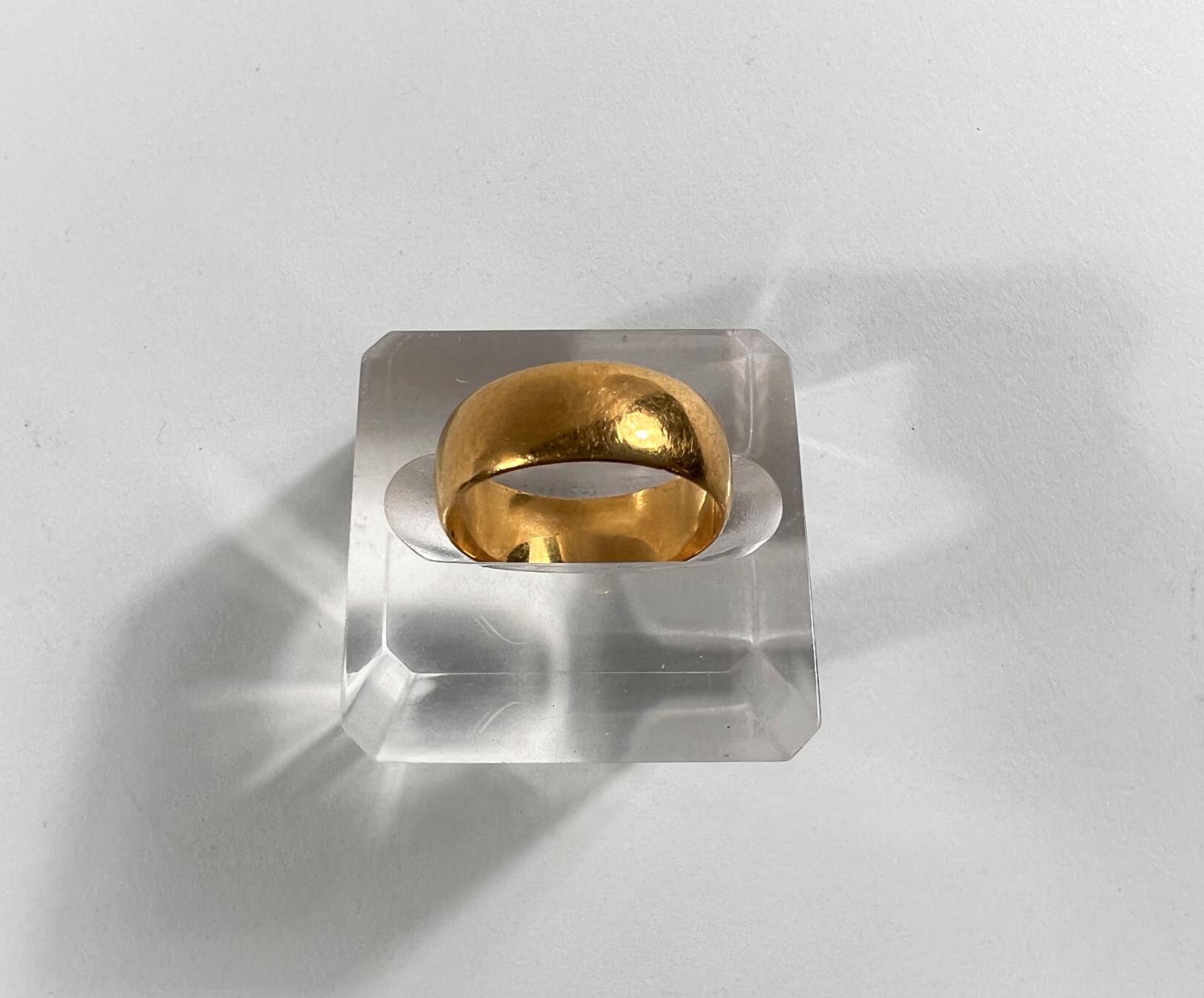 A small wide barrel shaped 22 carat hallmarked gold wedding ring, 6gm