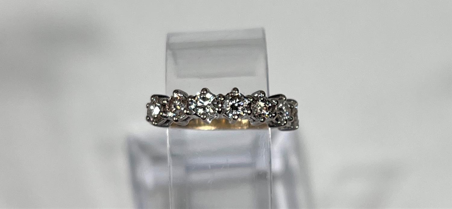 An 18 carat hallmarked gold half eternity ring set 7 diamonds, 3.5mm diameter of stones approx - Image 2 of 7