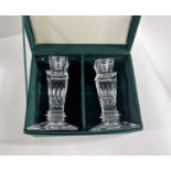 A pair of boxed glass candle sticks for Neiman Marcus of square form
