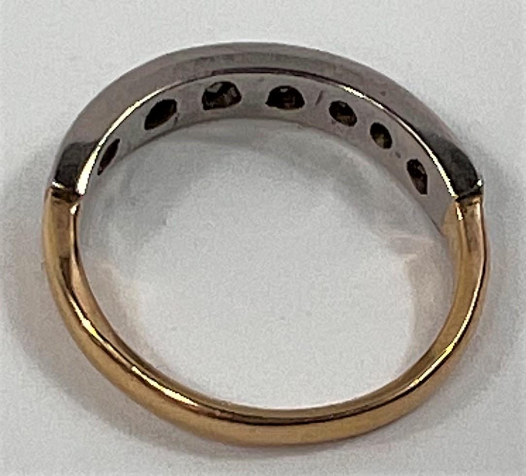 A half eternity ring set with 7 small diamonds on yellow metal shank, stamped 18ct, size K, 2.4gms - Image 2 of 2