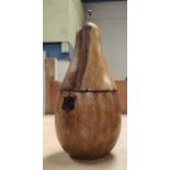 A carved fruitwood tea caddy in the form of a pear