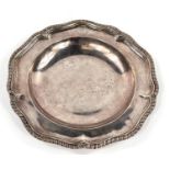 A Georgian hallmarked silver shallow dish with gadrooned wavy rim, monogrammed, London 1817, maker