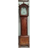 An early 19th century mahogany longcase clock with crossbanded decoration, the hood with brass