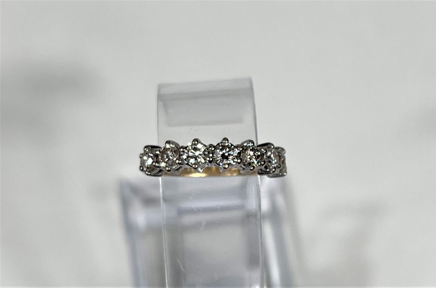 An 18 carat hallmarked gold half eternity ring set 7 diamonds, 3.5mm diameter of stones approx - Image 3 of 7