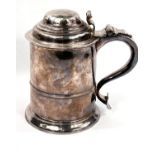 A mid Georgian hallmarked silver quart tankard of ribbed cylindrical form, with hinged lid and