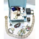A selection of costume jewellery inc. bangles, brooches etc; a silvered Art Nouveau belt
