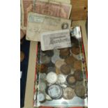 A mixed collection of coins and banknotes