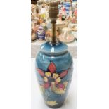 A Moorcroft table lamp, pale blue ground with floral decoration, full height 38cm