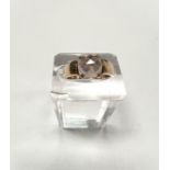 A 9 carat hallmarked gold ring set with a square facetted smoky colour stone, 2.4gm gross, size Q