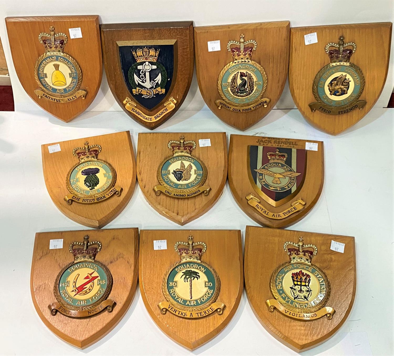 Ten RAF wooden shields of various units and a selection of military pictures and prints