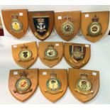 Ten RAF wooden shields of various units and a selection of military pictures and prints