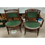 A matched pair of mahogany armchairs with green upholstery
