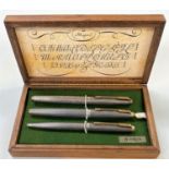 A Parker boxed set of 2 white metal fountain pens and 1 white metal ballpoint pen stamped 'Sterling