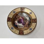 A 19th century Vienna porcelain cabinet dish 'Aglaia bound by Cupid' hand painted with gilt