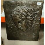 A large bronze relief plaque depicting the 'head of Leada'  rounded rectangular edges 50 x 40cm