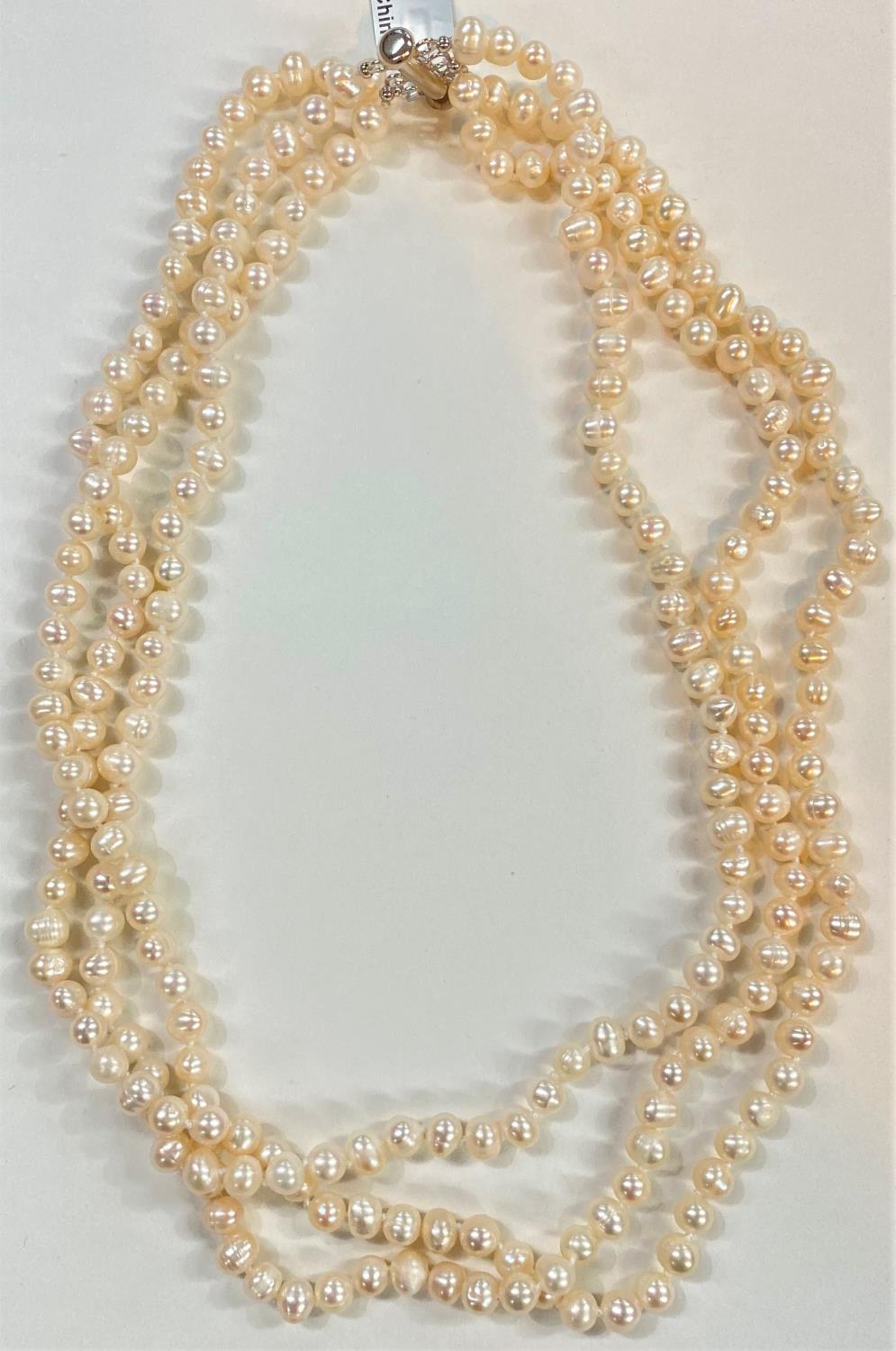 A triple necklace of naturally coloured kaori pearls, 6.5 x 5mm; a similar pearl pendant necklace - Image 2 of 4