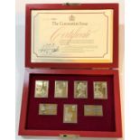 A hallmarked silver set of ingots depicting postage stamps, boxed, for QEII Silver Jubilee,