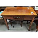 A mahogany fold over card table on square canted legs with single drawer.